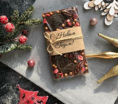 an assortment of cookies and other holiday decorations on a table with a tag that says, haddon yogurt