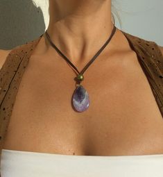 "Amethyst Pendant Necklace for Women, Amethyst Gemstone Necklace, Leather Necklace, Natural Stone Necklace belong to gemstone jewelry as well as boho jewelry carefully designed and crafted by EndiaDesign. Show off a boho style with this unique necklace for women made of high quality cow leather, an amethyst (tiger eye, pink quartz or aventurine) gem pendant and beads in antique bronze tone. Amethyst Healing Properties ♥ Increases nobility ♥ Spiritual awareness ♥ Psychic abilities ♥ Inner peace a Adjustable Gemstone Pendant Crystal Necklace, Amethyst Gemstone Crystal Necklace, Adjustable Crystal Necklace With Natural Stones, Adjustable Lavender Gemstone Necklace, Amethyst Crystal Necklace For Healing, Purple Mineral Crystal Pendant Jewelry, Adjustable Amethyst Pendant Crystal Necklace, Adjustable Amethyst Jewelry With Large Stone, Adjustable Purple Necklaces