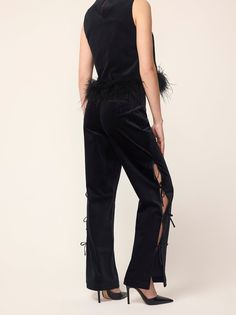 She's a showstopper. Introducing Rosamund, a straight-leg pin-tuck trouser with functional satin ties along to outer edge of each leg, showing a scintilla of skin between each (should you please). Crafted from our new cotton-blend velvet, she is structured whilst still feeling soft to the touch. Details Concealed side-zip Mid-rise Slim fit Length: Regular Fit & Measurements Model is 5’10” and wears a size 8 UK size 8 measures 78cm/33in in length, waist 70cm/29in Fabric & Care 98% Cotton, 2% Elas Black Velvet Trousers, Feather Top, Feather Tops, Heel Accessories, Velvet Trousers, Lou Lou, Centre Stage, Skirt Co Ord, Flat Boots