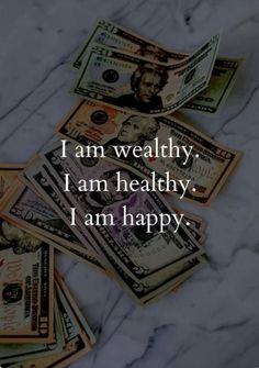 stacks of money sitting on top of each other with the words i am healthy i am healthy