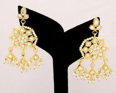 Indian Kundan Choker Pearls Earrings Jhumki Stacking Party Wear Women Jewelry Indian Jewellery Style Bridal Wedding Fashion Designer Set ITEM DESCRIPTION Metal = Gold Plated Occasion = Wedding ,Party Wear, Bridal Color = Clear and Yellow Size = Necklace Length = 8 Inches Long, Earring Size = 2.5 Inches Long, Code = FKN20 Free Shipping Your order will be shipped by Indian Postal Service and it takes 6 to 18 days in delivery. I also have fast shipping option to deliver your order in 3 to 6 days. P Festive Temple Jewelry Jhumkas For Party, White Temple Jewelry Danglers For Festive Season, Festive White Bridal Earrings With Latkans, Temple Jewelry Jhumkas For Festivals And Parties, Bollywood Style White Bridal Earrings With Gota Work, Diwali Party Bridal Earrings With Cutdana, Diwali Party Bridal Cutdana Earrings, White Cutdana Danglers For Festivals, White Danglers With Cutdana For Celebration