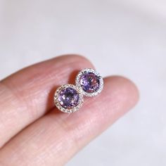 "These stylish earrings have a stunning bright color and the Amethyst is surrounded by a halo of shimmering diamonds. Perfect as a gift for yourself, your girlfriend or wife, or your mother. Features * Made to Order. * Metal: 925 Sterling Silver * Custom Color: Silver, Gold, Rose Gold * Main Stone: Amethyst, 5mm dia Round Shape, 2pcs * Side Stone: Cubic Zirconia Amethyst Ring: * Halo Ring: https://etsy.me/32kkc68 * Bypassing: https://etsy.me/32u2NIF Be sure to hit \"favorite\" on the right so it Tanzanite Round Earrings As Gifts, Round Tanzanite Earrings For Gifts, Round Tanzanite Earrings Gift, Tanzanite Birthstone Earrings As Gift, Tanzanite Birthstone Earrings For Gifts, Fine Jewelry Crystal Gemstone Earrings For Anniversary, Round Purple Gemstones As A Gift, Round Purple Gemstones For Gifts, Round Purple Gemstones As Gifts