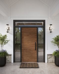 a wooden door with two planters in front of it and an entrance mat on the floor