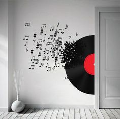 vinyl record wall decal with musical notes coming out of the top and on it's side