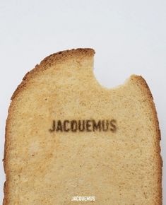 a piece of bread with the word jacquemus written on it