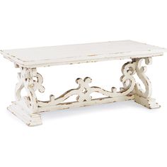 an old white wooden table with carvings on the top and bottom, against a white background