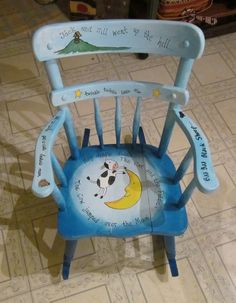 a child's blue plastic chair with a cartoon character on the back and seat