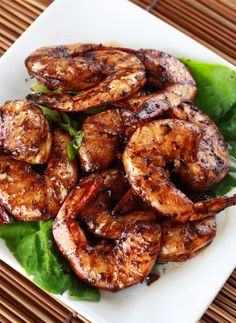 grilled shrimp and lettuce on a white plate