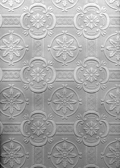 an old fashioned tin ceiling with decorative designs on it