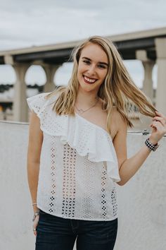 Eyelet one shoulder top featuring the cutest ruffle detail! Maddie is wearing a size smallLightweightThis item is final sale.