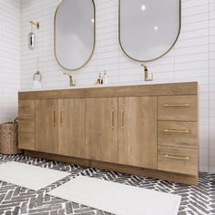 a bathroom with two sinks and mirrors on the wall above it is tiled flooring