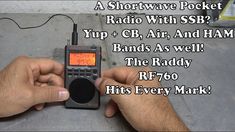 a man is holding a radio in his hand with the words, a shortwave pocket radio with ssb? up + cb air and ham bands as well