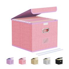 a pink storage box with several different colored boxes around it and the lid opened to reveal an empty file