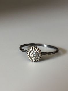 Welcome to Miss November Studio! I specialize in dainty feminine personalized jewelry for the discerning jewelry lover. This listing is for a single sterling silver sunflower stacking ring. All other rings are sold separately. Make a stack! Add a custom stamped band and two gemstone stacking rings with stones like black onyx and garnet. https://www.etsy.com/listing/150142799/set-of-3-rings-one-personalized-message Stacking rings are excellent accessories, not to mention fun to collect and wear. Dainty Silver Stackable Jewelry, Dainty Stackable Sterling Silver Jewelry, Tiny Silver Stackable Rings As Gift, Silver Dainty Stackable Jewelry, Silver Stackable Dainty Jewelry, Stackable Dainty Sterling Silver Jewelry, Everyday Sterling Silver Nickel-free Midi Rings, Everyday Nickel-free Sterling Silver Midi Rings, Dainty Silver Stackable Adjustable Rings