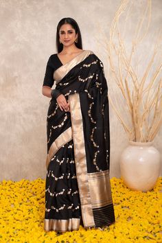 Expertly crafted with pure Katan silk, this black Banarasi saree features intricate Kaduwa sona rupa motifs. The traditional design and luxurious fabric make it a versatile addition to any wardrobe. Elevate your style with this exquisite and timeless piece. Festive Black Pre-draped Saree With Self Design, Black Silk Saree With Resham Embroidery, Black Silk Pre-draped Saree With Resham Embroidery, Elegant Black Silk Pre-draped Saree, Black Tussar Silk Saree With Self Design, Black Raw Silk Saree With Self Design, Black Art Silk Pre-draped Saree With Zari Weaving, Black Pre-draped Saree With Zari Weaving For Puja, Black Raw Silk Saree For Wedding