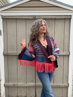 "This is a ONE of a kind, original Zasra design. It is a handmade, funky, eco friendly, artisan wrap. The design of this artisan wrap jacket, is a slouchy design with wide bell sleeves, and a slight asymmetrical front. The idea is to wear it either loose and free floating at your sides or wrap it around with a favorite sash or obi belt. If interested in a patchwork, reversible obi belt, please convo me for prices and possibilities. For this particular wrap I have chosen a bold rich mix of denim Bohemian Cotton Outerwear With Tassels, Multicolor Long Sleeve Outerwear With Tassels, Fitted Bohemian Outerwear With Tassels, Fringe Long Sleeve Cardigan For Festivals, Bohemian Long Sleeve Fringe Outerwear, One Size Hippie Outerwear For Festivals, Hippie Festival Outerwear One Size, Bohemian Multicolor Outerwear With Tassels, Bohemian Fringe Cardigan For Festivals