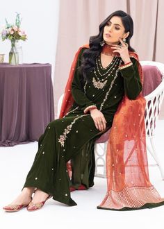 Green velvet kameez has beautiful zari , sequin and beads hand embroidery with brocade straight pant. ⭐ PLEASE NOTE This dress has contrast orange organza dupatta.There will be sequin small motif all over the dupatta without borders (as you can see in picture),there will be no borders in the dupatta  ✨If you want any changes in the outfit please contact us we will guide you as per your preference. ✨We assure you that we use only high quality fabric and threads to make any dress and you won't face any problem regarding fabric.  ✨We take little longer time for manufacturing the garment as this is custom made dress and we take utmost care while manufacturing, so that our customers gets full satisfaction when they receive  the dress. Your patience is important. 🌸Care Instructions Dry clean on Elegant Velvet Kurta With Mirror Work, Diwali Velvet Dabka Sets, Diwali Velvet Kurta With Mirror Work, Velvet Long Sleeve Festival Sets, Green Velvet Sets For Eid, Velvet Long Sleeve Sets For Festivals, Party Velvet Sharara With Mirror Work, Festive Velvet Semi-stitched Sharara, Velvet Long Sleeve Salwar Kameez With Resham Embroidery