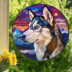 a stained glass window with a husky dog on it