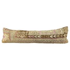 a decorative pillow with an intricate design on the front and back, made from woven material