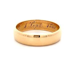 This Victorian 18 karat yellow gold wedding band captures the essence of the era with its rounded flat edge, offering a unique and elegant profile. The inside of the ring features the original wedding date engraving, adding a sentimental touch that connects to its rich history. Perfect for those who appreciate vintage beauty and historical significance, this wedding band is a testament to enduring love and tradition Yellow Gold Engraved Ring Stamped 14k For Marriage, Classic Wide Band Wedding Bands, Heirloom 14k Gold Engraved Bands, Classic Wide Band Wedding Ring, Heirloom 14k Engraved Wedding Ring, Timeless Anniversary Signet Ring With Smooth Bezel, Classic Engraved Ring With Thick Band And Polished Finish, Heirloom Gold Ring For Promise, Formal Engraved Ring With Polished Finish And Thick Band