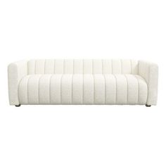 a white couch sitting on top of a wooden floor