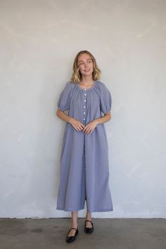 Gingham button down midi dress with puff sleeves and side pockets. - Sizing: Model is 5'8", wearing a size S - Content: 50% Cotton, 50% Polyester Care: Handwash recommended Imported