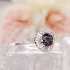 Art Deco Bridal Wedding Ring / Round Cut 1.00CT Alexandrite Ring/ Fantastic Women's Promise Gold Ring/ Accents Moissanite Ring/ Fine Jewelry ------------Specifications------------ Engagement Ring: Center Stone - 6.5mm Round Cut Alexandrite - 1.00CT Stone Clarity - VS Side Stones - 0.22ctw Moissanite Width of the Band - 1.50mm Weight of the Gold - 3.10g ------------SIZES------------ This ring is made to order in any size, please drop down the Options box to choose the gold color and ring size. Si Anniversary Halo Topaz Ring, Wedding Halo Ring With Round Gemstone, Round Cut Gemstone Halo Ring For Wedding, Anniversary White Gold Flower Ring With Gemstone, White Gold Topaz Ring With Halo For Anniversary, Wedding Birthstone Ring With Halo Setting And Round Stone, Wedding Birthstone Ring With Halo Design In Cubic Zirconia, White Gold Halo Birthstone Ring For Wedding, Wedding Halo Ring With Gemstone