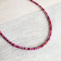 "A long pink and fuchsia mixed glass bead necklace.  The closure is a pewter toggle clasp.  The long hand beaded necklace is available in two lengths (see photo with two options) - 30\" and 36\".  The colors of the beads are a mix of raspberry, cranberry and light pink tones.  The necklace can be wrapped around the wrist several times for a multi-layered bracelet.  You can also purchase charms to be added to the necklace from my shop here (make note at checkout that you wish for charms to be attached): https://www.etsy.com/listing/1147255532/personalized-sterling-silver-charm?click_key=41a8f205aa77c475953fc701d4090ca3beec6950%3A1147255532&click_sum=06541664&ref=shop_home_active_2&crt=1&sts=1 Your long glass beaded necklace will arrive in an E. Ria Designs jewelry gift box, ready for giving Pink Beaded Necklaces With Spacer Beads For Gifts, Pink Beaded Chain Beads As Gift, Pink Beaded Chain Jewelry For Gift, Pink Single Strand Beaded Necklaces For Jewelry Making, Pink Tiny Beads Necklace For Jewelry Making, Pink Beaded Necklace With Tiny Beads For Gift, Pink Beaded Necklace With Round Beads For Gifts, Pink Round Beaded Necklace For Gift, Pink Round Beaded Jewelry For Festivals