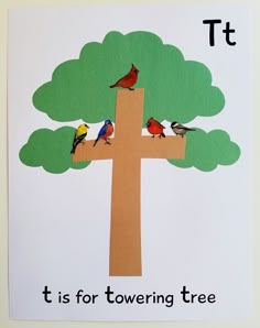 a cross made out of paper with birds sitting on it and the words t is for towering tree