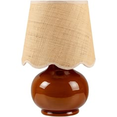 a brown table lamp with a beige shade on the top and bottom part of it