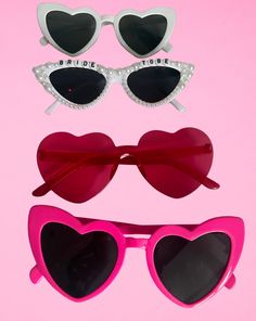 **Fun & Fabulous Hen Party Sunglasses | Perfect for Your Bridal Bash Make your hen party unforgettable with our stylish and playful variety of hen party sunglasses! Whether you're hitting the beach, heading to a club, or just enjoying a fun day out, these sunglasses are the perfect accessory to add a touch of glamour and fun to your celebration. Glamorous Pink Party Sunglasses, Glamorous Pink Sunglasses For Party, Playful Sunglasses For Party, Heart-shaped Pink Sunglasses For Gift, Pink Heart-shaped Sunglasses As Gift, Heart-shaped Pink Sunglasses As Gift, Valentine's Day Party Sunglasses With Tinted Lenses, Pink Tinted Sunglasses For Party, Playful Party Sunglasses For Valentine's Day