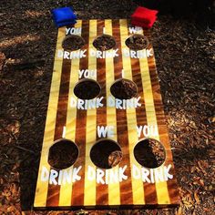 a cornhole game set up on the ground with i drink drunk written on it