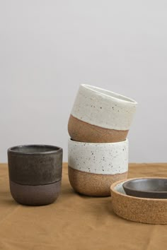 three bowls are stacked on top of each other