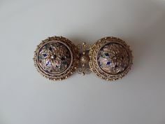 Traditional Norwegian (Solje) wedding brooch by David Andersen, Oslo, made 1888-1925. In the shape of two Viking shields, very delicately crafted, completely gold-plated and partly cloisonne enamelled. Stamped on the back with the David Andersen hallmark and 830 pp. Width 4.5 cm, 1.8 inches, depth 2 cm, 0.8 " and height approximately 1 cm Condition: partial loss of enamel Viking Shields, Viking Shield, Wedding Brooch, The David, Cloisonne Enamel, Brooch Pin, Vikings, Sweden, Brooches