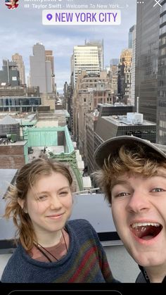 two people are taking a selfie in new york city, one is smiling and the other is laughing