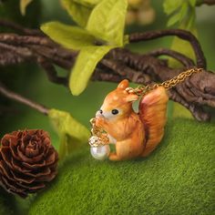 Unleash your inner tree-hugger with our playful Squirrel Necklace. This quirky accessory adds a touch of charm and whimsy to any outfit. The perfect gift for nature lovers and animal enthusiasts alike! DETAILS Plating: 18K Gold Materials:   18K Gold on Brass, Enamel Measurements: 18.50 "(47cm) Pendant Size: 1.02"*1.06"(2.6cm*2.7cm) Weight: 24.3g Clay Animal Jewelry, Squirrel Necklace, Brass Pendant Necklace, Animal Pendant, Enamel Necklaces, Tree Hugger, Nature Inspired Jewelry, Handmade Clay, Gifts For Nature Lovers