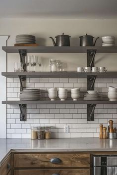 the shelves in this kitchen are filled with dishes