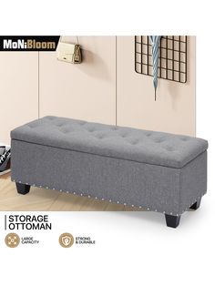 the storage ottoman is upholstered with studding on it's legs and feet