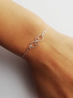 Lovely Infinity solid silver 925 women's bracelet. Charm design jewelry. Double hearts motif. Gift idea for mother of twins. Simply jewelry.  Dainty Infinity bracelet for girl.  Anniversary present idea for her.  This pretty bracelet is made of sterling silver 925.  Length 16cm + Adjustable 4cm Ready to ship in 1-3 business days. Visit our shop here  https://etsy.me/2YxPw10 Visit our Facebook Page 👇👇 https://www.facebook.com/KatoO-Jewelry-320908688837927/ Elegant Heart-shaped Bracelet For Mom, Elegant Hypoallergenic Bracelet For Mom, Minimalist Bracelets As Gift For Mom, Elegant Sterling Silver Heart Bracelet Gift, Elegant Infinity Heart Bracelet As Gift, Elegant Infinity Heart Bracelet Gift, Elegant Infinity Heart Bracelet For Gift, Elegant Sterling Silver Bracelet As Gift For Mom, Elegant Nickel Free Heart Bracelet For Mother's Day