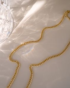 Make a statement with the Tribeca Curb Chain Choker! Perfect for layering and creating unique looks, this choker will provide a subtle but bold look. Express yourself and show off your style with the Tribeca Curb Chain Choker! NECKLACE FEATURES Material: Brass, 16K Gold Filled Chain Dimension: 3X2.2mm Chain Thickness: 0.4mm Chain Style: Curb Chain Lead Free, Nickel Free Size: 16" with 2" chain extender Chic Yellow Gold Necklace With Chain Strap, Trendy Link Chain Strap Necklace, Chic Link Necklace With Double Chain, Chic Double Chain Link Necklace, Modern Chunky Chain Choker Necklace, Luxury Chunky Chain Choker Necklace, Classic Choker Necklace With Adjustable Chain, Modern Link Necklace With Chain Strap, Elegant Metal Choker With Curb Chain