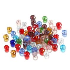 many different colored beads on a white surface