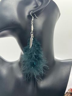 Elevate your style with these sophisticated Black Feather with Faux Pearl earrings. Each earring features a sleek black feather, paired with a lustrous faux pearl, creating a striking contrast that exudes elegance and charm. The combination of the delicate feather and the shimmering pearl adds a touch of timeless beauty to any outfit. Crafted with high-quality materials, these earrings are designed to last while providing a touch of luxury. The natural grace of the black feathers and the classic appeal of the faux pearls make these earrings a versatile accessory for any occasion. Whether you're dressing up for a special event or adding a touch of sophistication to your everyday look, these earrings are sure to make a statement. Faux Pearl Earrings, Black Feathers, Timeless Beauty, Everyday Look, Faux Pearl, Jewelry Earrings Dangle, Etsy Earrings, The Black, Dangle Drop Earrings