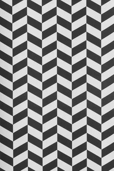 an abstract black and white pattern with diagonal stripes on it's surface, in the style of zigzag