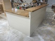 a workbench in a garage with tools on the counter