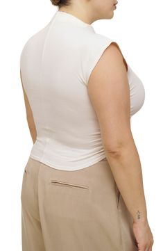 Stretch-hinted organic cotton offers exceptional comfort in this ruched crop top with an elegant mock neckline. 19" length (size Medium) Mock neck Sleeveless 88% organic cotton, 12% spandex Machine wash, tumble dry Imported Fitted Beige Tops With Built-in Bra, Sleeveless Ruched Beige Tops, Beige Sleeveless Ruched Top, Beige Ruched Sleeveless Top, Fitted Ruched Crop Top, Flattering Fitted Sleeveless Top, Fitted Ruched Elastane Crop Top, Fitted Casual Top With Ruched Back, Fitted Top With Ruched Sides