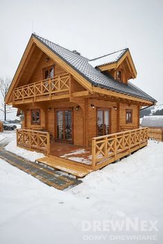 a small wooden house in the snow