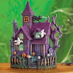 a figurine of a house decorated with halloween decorations