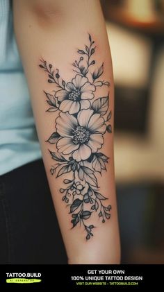 a woman's arm with flowers on it and the words get your own design