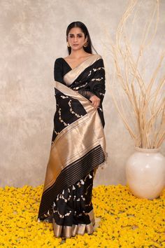 Expertly crafted with pure Katan silk, this black Banarasi saree features intricate Kaduwa sona rupa motifs. The traditional design and luxurious fabric make it a versatile addition to any wardrobe. Elevate your style with this exquisite and timeless piece. Festive Black Pre-draped Saree With Self Design, Elegant Black Silk Pre-draped Saree, Black Tussar Silk Saree With Self Design, Black Raw Silk Saree With Self Design, Black Art Silk Pre-draped Saree With Zari Weaving, Black Pre-draped Saree With Zari Weaving For Puja, Black Raw Silk Saree For Wedding, Elegant Black Raw Silk Saree, Black Raw Silk Dupatta In Traditional Drape