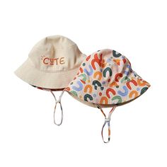 Protect your little one in style with this CUTE Sun Hat! This colorful reversible staple comes complete with one side that declares "cute" on it. So sweet! Playful Adjustable Cotton Bucket Hat, Adjustable Cotton Bucket Hat In Playful Style, Playful White Sun Hat With Curved Brim, Adjustable Fit Hats For Playtime In Spring, Spring Adjustable Fit Hat For Playtime, White Bucket Hat For Playtime In Spring, White Spring Bucket Hat For Playtime, White Bucket Hat For Spring Playtime, Casual Multicolor Letter Print Hats